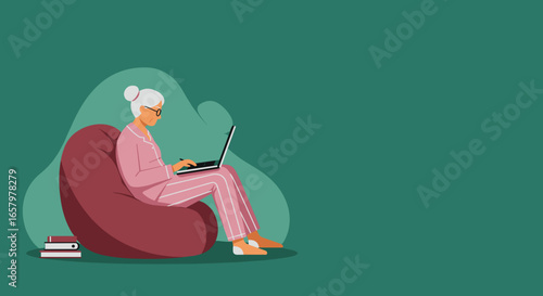 Senior woman in pajamas comfortably uses laptop on a bean bag chair at home, illustrating digital engagement and modern lifestyle.