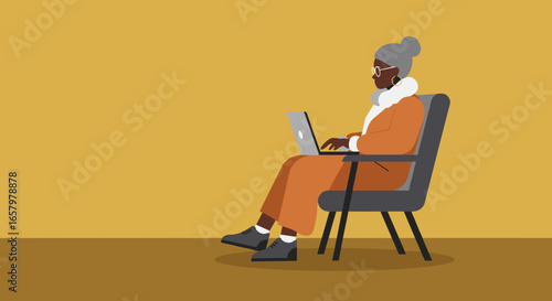 Senior Black woman comfortably working on a laptop, showcasing digital literacy, online learning, or remote work for older adults.