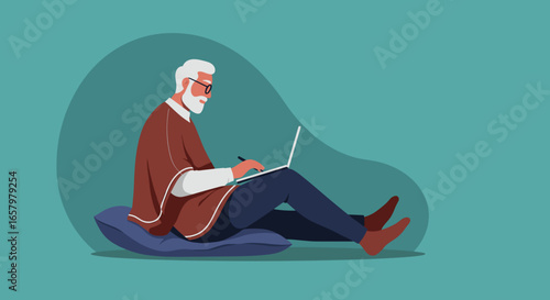 Senior man with beard and glasses, relaxed, sitting on a cushion, focused on his laptop. Ideal for themes of remote work, online learning, or digital leisure.