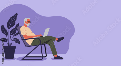 Senior man comfortably using a laptop at home, embodying modern remote work, digital leisure, and connected living for older adults.