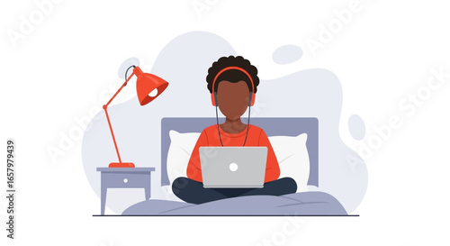 Person with headphones focused on a laptop in bed, representing remote work, online learning, and comfortable digital lifestyle.