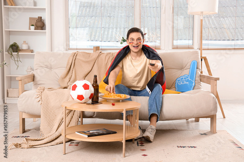 Male sports fan with German...