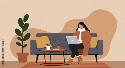 Woman works remotely on laptop from comfortable home sofa. Ideal for remote work, online learning, cozy lifestyle, or digital nomad concepts.