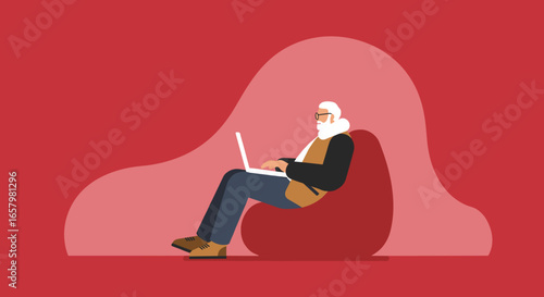 Elderly man with a white beard and glasses comfortably uses a laptop on a bean bag chair, representing remote work, leisure, or online learning.