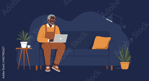 Relaxed senior Black man using laptop on a couch in a cozy home environment. Illustrates modern lifestyle, connectivity, and remote work.