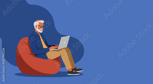 Senior man comfortably works on laptop, embracing technology in a relaxed home environment. Ideal for remote work, digital lifestyle, or online learning concepts.