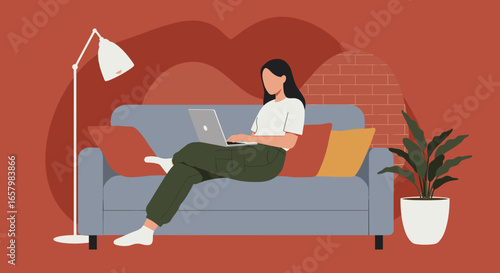 A young woman comfortably works on her laptop from a modern sofa at home. Ideal for remote work, online learning, or digital lifestyle concepts.
