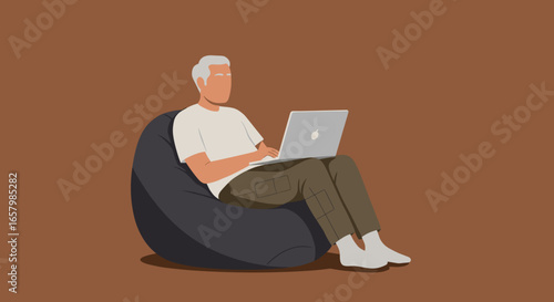 Elderly man comfortably working or browsing on a laptop from a bean bag chair. Ideal for remote work, technology, or modern lifestyle themes.