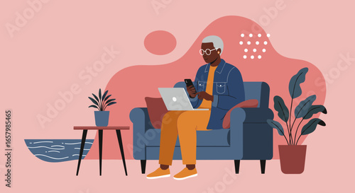 Senior African American man comfortably using his laptop and phone on a sofa at home, depicting modern lifestyle, digital connection, and remote work.