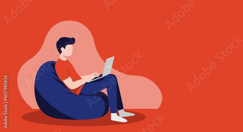 Young man comfortably working or studying on a laptop from a bean bag chair at home, representing remote work, education, or freelance lifestyle.
