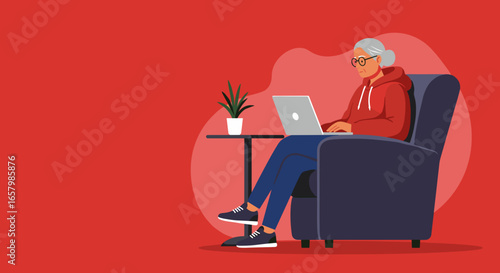 Elderly woman focused on her laptop in a comfortable armchair at home. Represents digital literacy, remote work, or online learning for seniors.