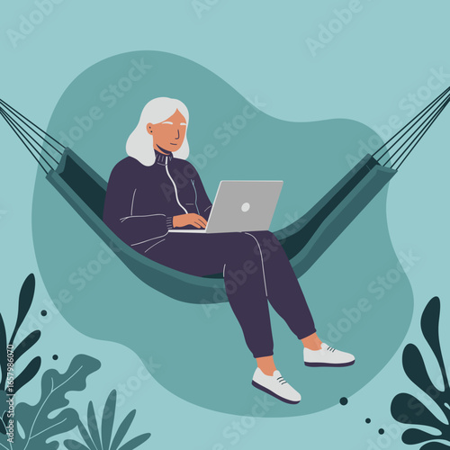 Senior woman comfortably working on a laptop in a hammock outdoors. Represents remote work, leisure, and a relaxed modern lifestyle for older adults.