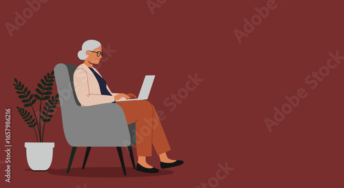 Happy senior woman in glasses relaxing on an armchair, working on a laptop computer. Modern elderly living, remote work, or online learning concept.