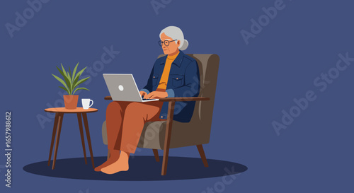 Modern senior woman with glasses and grey hair comfortably uses a laptop in her home, illustrating digital literacy and active retirement.