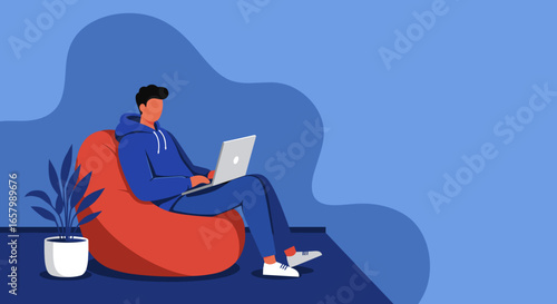 Young person comfortably works or studies remotely on a laptop from a bean bag chair, symbolizing modern digital lifestyle and flexible work.