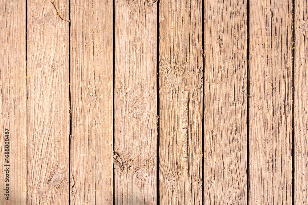 Fototapeta premium Oiled wood, showing its natural resilience with golden tones that change with the light