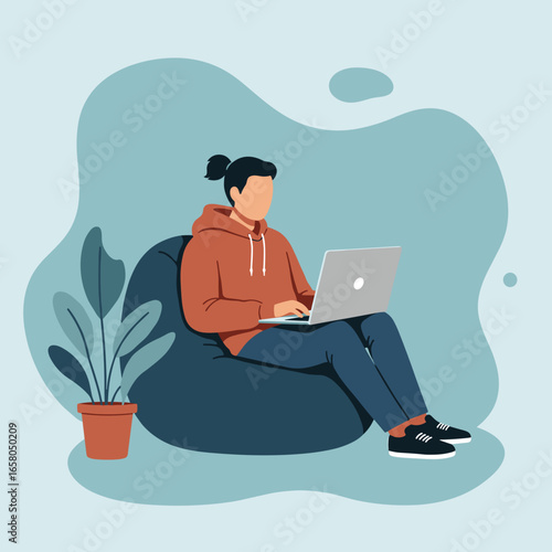 A person works remotely on a laptop from the comfort of a bean bag chair at home. Ideal for concepts of flexible work, freelance, online learning, or digital lifestyle.