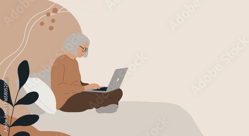 Elderly woman comfortably using a laptop at home, embracing technology for online learning, remote work, or leisure. Represents digital inclusion and modern senior lifestyle.