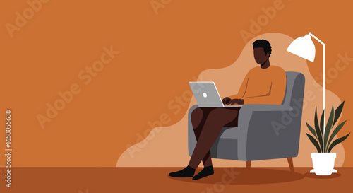Man working remotely on laptop from a comfortable armchair at home. Represents freelance work, online education, and modern digital lifestyle.