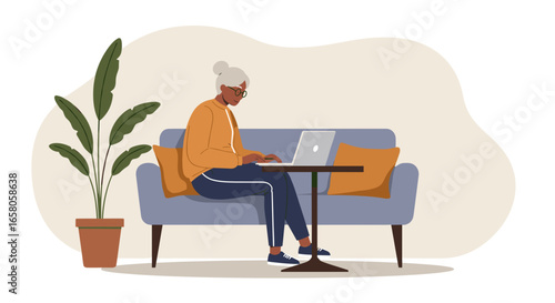 Senior woman confidently working on her laptop from a comfortable home setting, embracing technology and remote productivity. Ideal for lifestyle and business concepts.