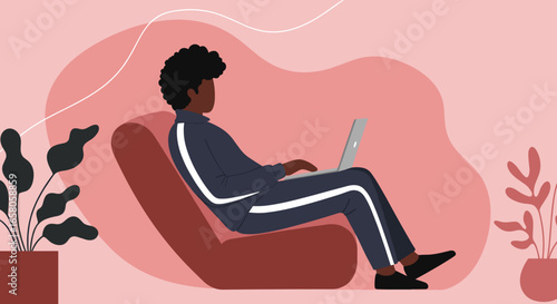 Young person comfortably working on a laptop at home, embodying remote work, digital learning, or leisure in a modern lifestyle.