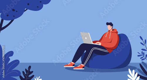 Young man comfortably working or studying on a laptop while relaxing on a bean bag outdoors, symbolizing modern remote work and flexible lifestyle.