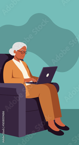 Mature woman comfortably uses a laptop in an armchair, embracing technology and digital communication from home. Ideal for lifestyle and senior tech concepts.