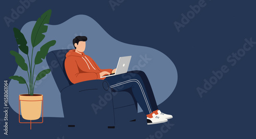 Young man working remotely on a laptop in a comfortable armchair at home. Represents flexible work, online learning, and modern digital lifestyle.