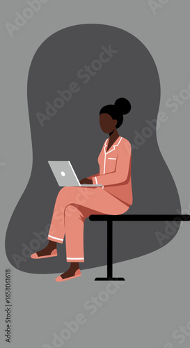 Woman in comfortable pajamas works remotely on laptop, embodying productive work-from-home lifestyle and modern flexibility.