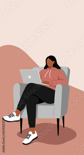 Person working on laptop in a cozy armchair, representing remote work, online learning, and a flexible digital lifestyle.
