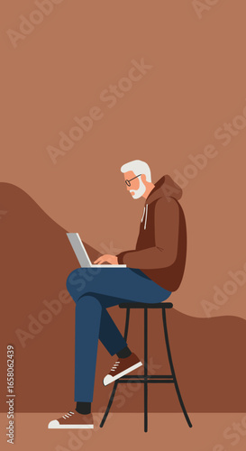 Senior man with a beard and glasses sits on a stool, diligently working or studying on a laptop. Represents modern digital lifestyle, remote work, or online learning.