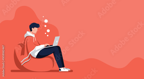 Young man comfortably working or studying on laptop at home. Perfect for remote work, online education, or digital lifestyle concepts.