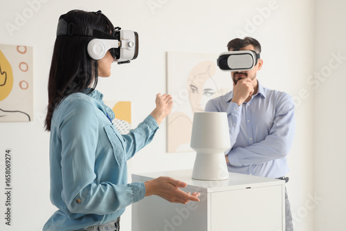 Young couple with VR glasse...