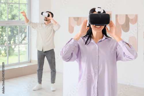 Young woman with VR glasses...