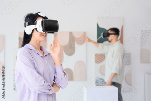 Young woman with VR glasses...