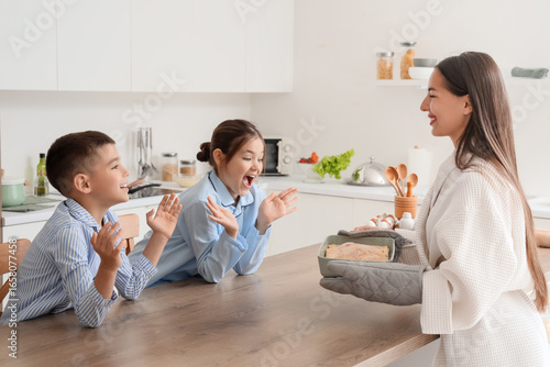 Young mother with tasty pie...