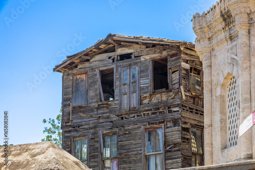 Old Abandoned Wooden House Beside Historical Stone Building