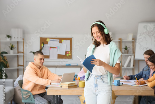 Female student with headpho...