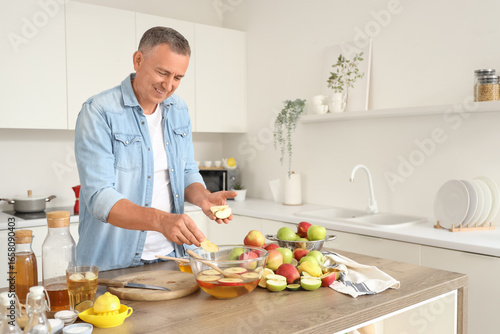 Smiling man preparing fresh...