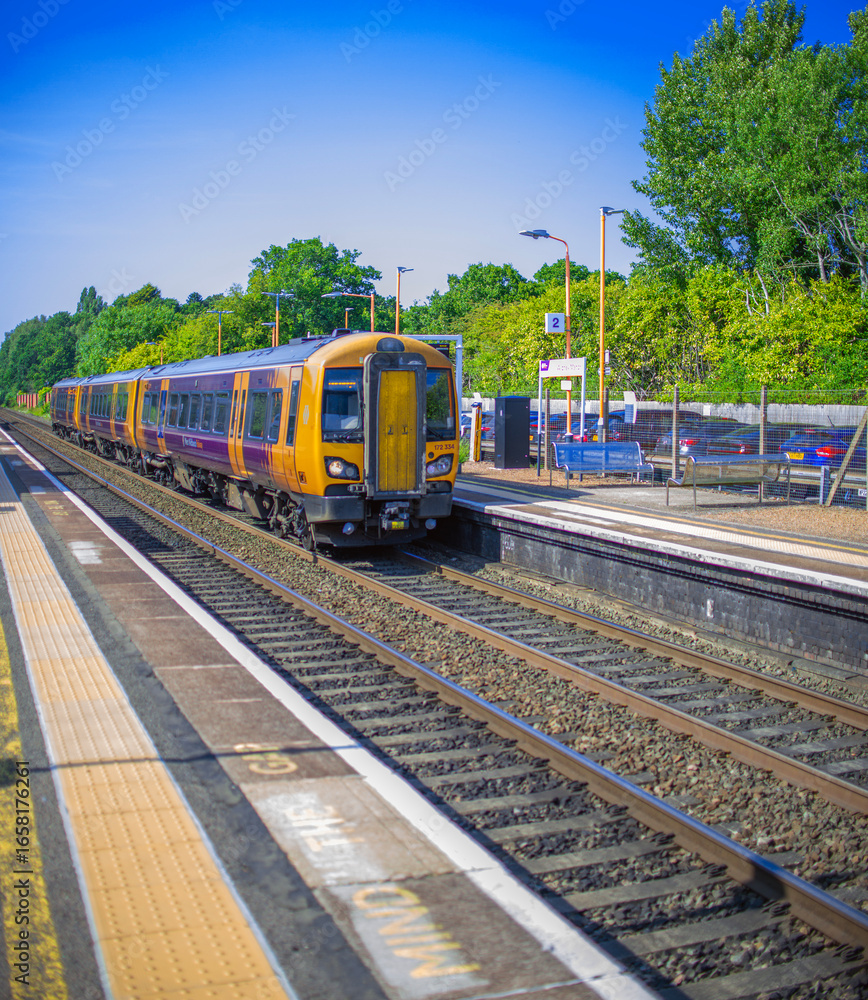 Fototapeta premium English British Rail Railways passenger suburban station. Commuter traffic in the suburbs of the West Midlands England UK. 