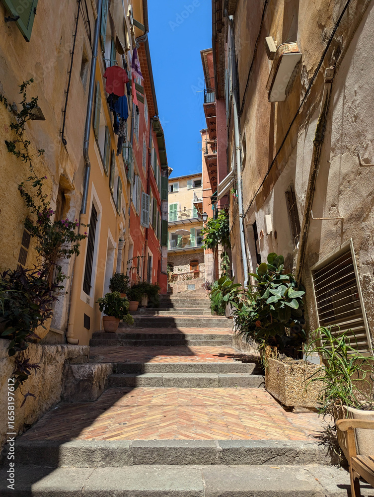 Obraz premium Narrow stairs in Villefranche, France shows the lifestyle of the French Riviera
