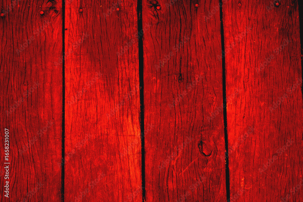 Red painted wooden plank wall with nail heads. Rustic background texture for design projects, interior decor, or construction materials concepts. Red painted wooden plank wall with nail heads. Rustic background texture for design projects, interior decor, or construction materials concepts.