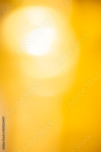 Golden abstract gradient background with smooth, flowing tones of yellow and brown. Perfect for luxury-themed designs, elegant presentations, and digital textures,Vertical