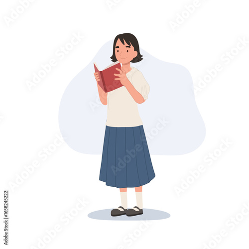 a young thai schoolgirl in uniform reading a book showing daily student life and education culture in thailand