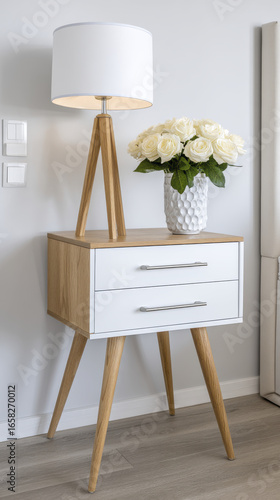 Wallpaper Mural Modern wooden side table with lamp and vase of white roses adds elegance to room, reflecting care in design and end of busy day Torontodigital.ca