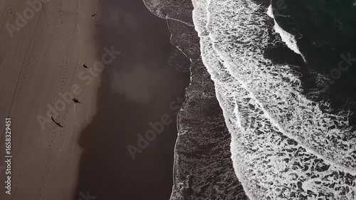 Aerial view of Parangtritis Beach in Bantul, Yogyakarta, Indonesia. Scenic coastline with rolling waves, golden sand, and tropical landscape, perfect for travel and tourism concepts.