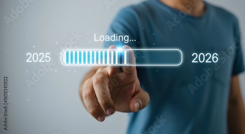Man touching loading bar, loading progress of year 2025 to 2026. business future vision success goal progress innovation strategy development concept