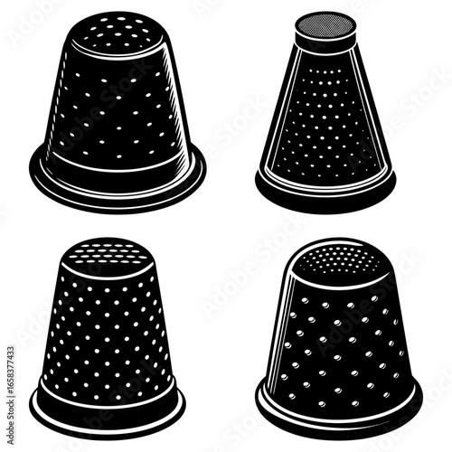 A collection of four black and white thimbles with varying hole patterns and shapes on a white background