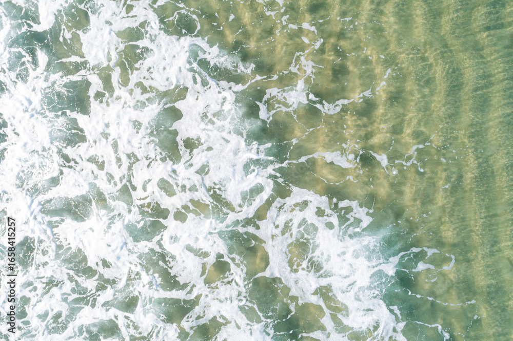 Obraz premium An Abstract Top Down View of a Wave and Sand Ripples. Concept The beautiful details of the sea.