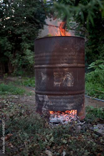 cleaning the area the barrel is used in the garden to burn garbage